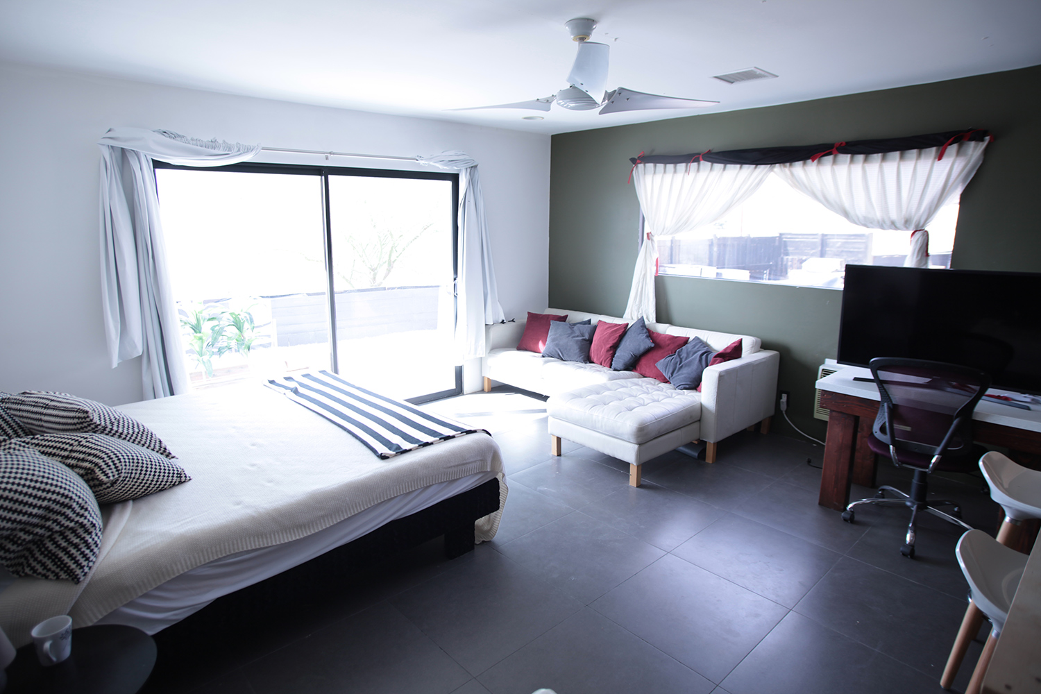 Final gallery image featuring the home and hillside setting